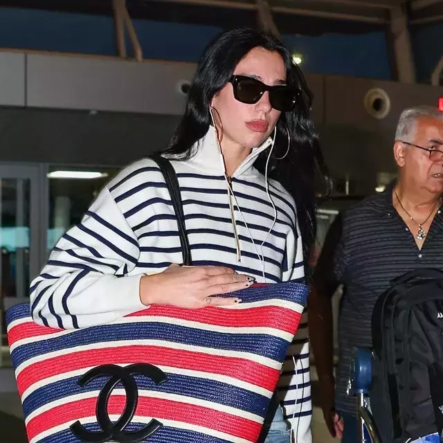 Dua Lipa Redefines Airport Chic with Oversized Chanel Tote